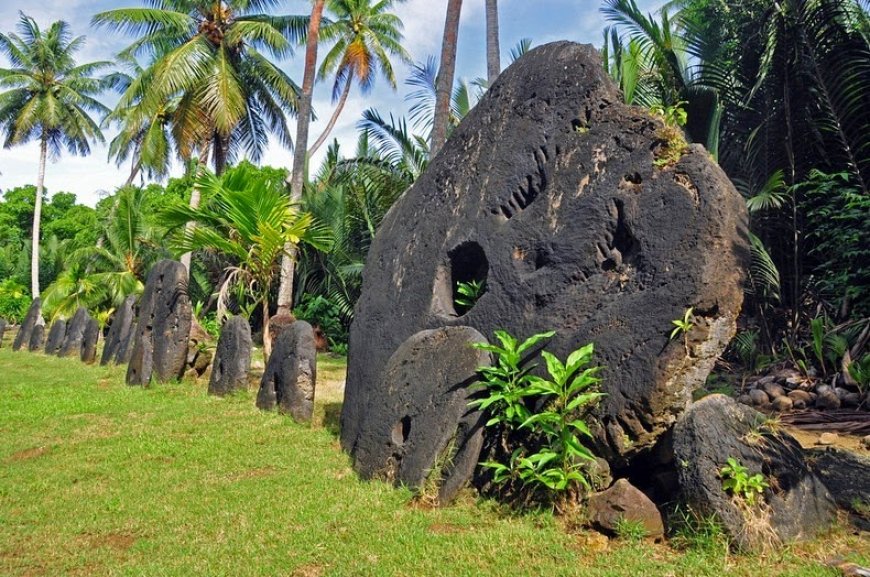 [HERO_IMAGE_ALT: Rai stone money in a tropical village setting on Yap]