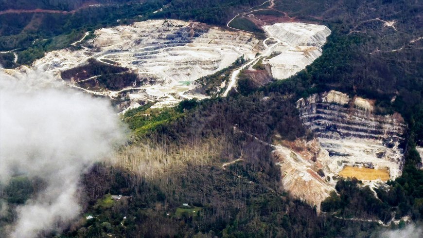 Quartz mining pit in Spruce Pine, North Carolina — the upstream chokepoint beneath semiconductors and solar